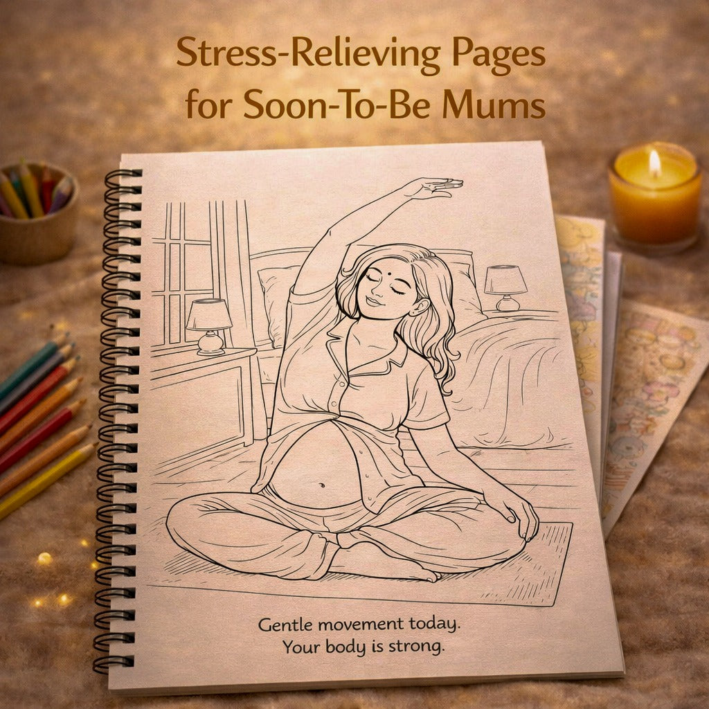 Notebook with a pregnancy-themed illustration on a wooden surface with candles and coloring books.